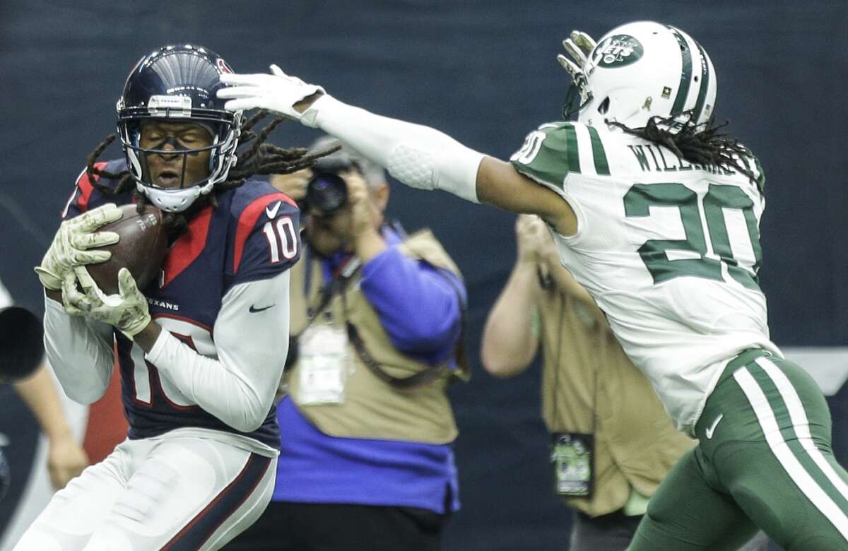 Houston Texans wide receiver DeAndre Hopkins (10) pulls down a 20-yard touchdown reception with New York Jets strong safety Marcus Williams (20) defending during the third quarter of an NFL football game at NRG Stadium on Sunday, Nov. 22, 2015, in Houston. ( Brett Coomer / Houston Chronicle )