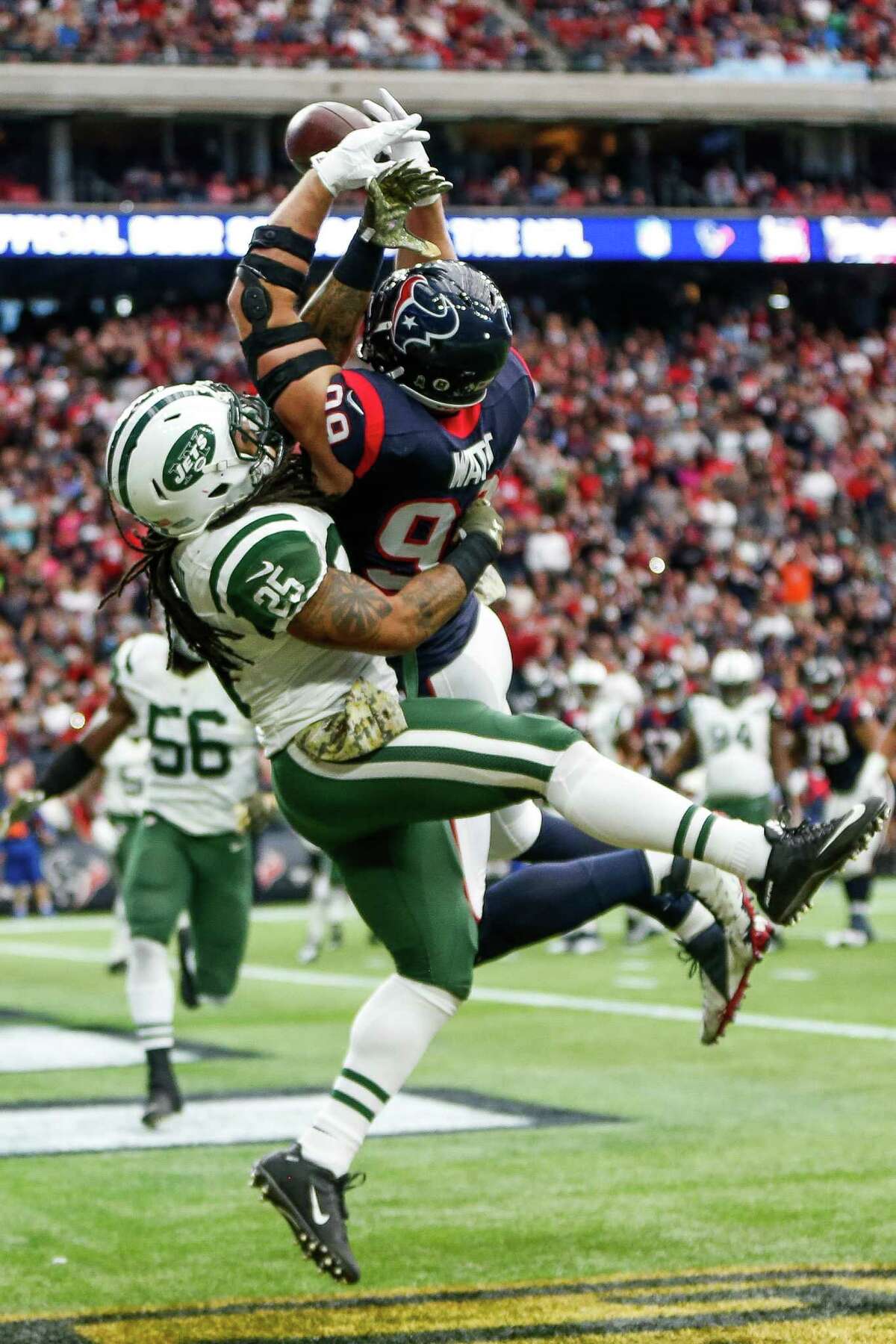 J.J. Watt fails to come up with a first-quarter pass while covered by Jets safety Calvin Pryor.