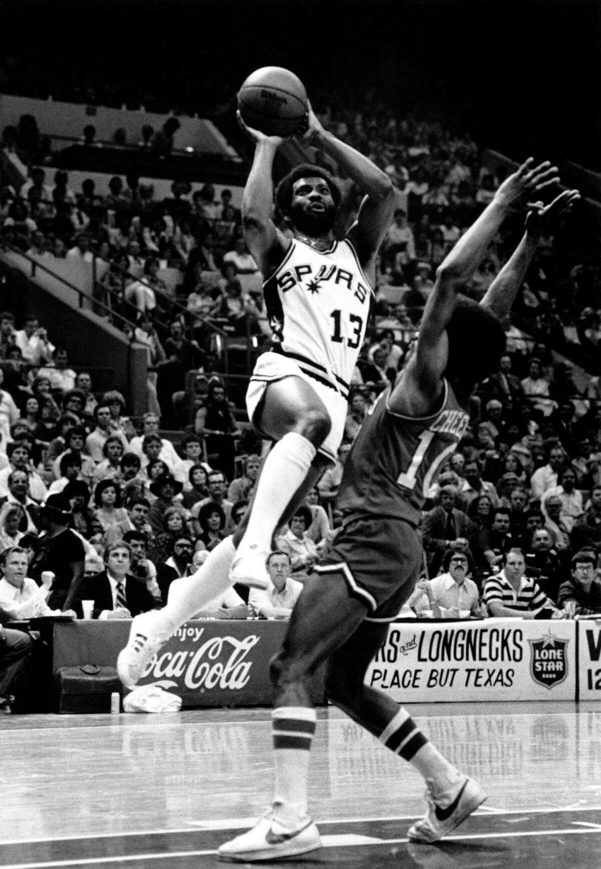 James Silas of the Spurs shoots over Philadelphia’s Maurice Cheeks, circa 1970s, at HemisFair Arena.