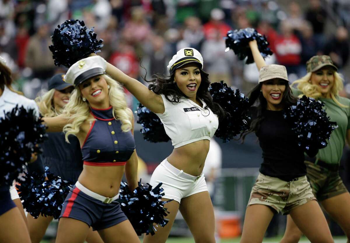 The Houston Texans cheerleaders wear military uniforms as a Salute to Service as they perform prior to an NFL football game, Sunday, Nov. 22, 2015, in Houston. (AP Photo/David J. Phillip)