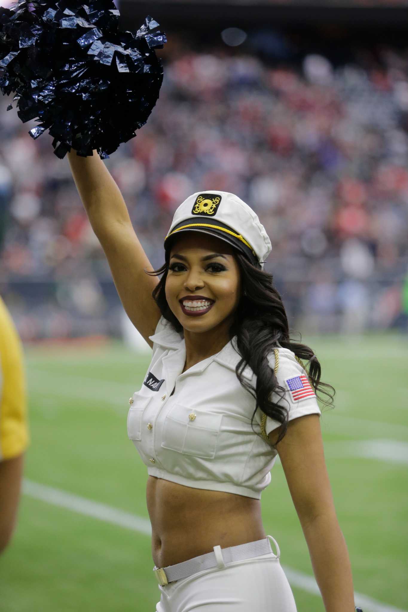 A Houston Texans cheerleader wearing a salute to service uniform