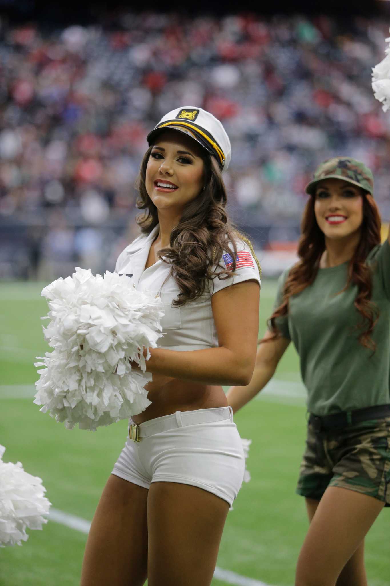 A Houston Texans cheerleader wearing a salute to service uniform