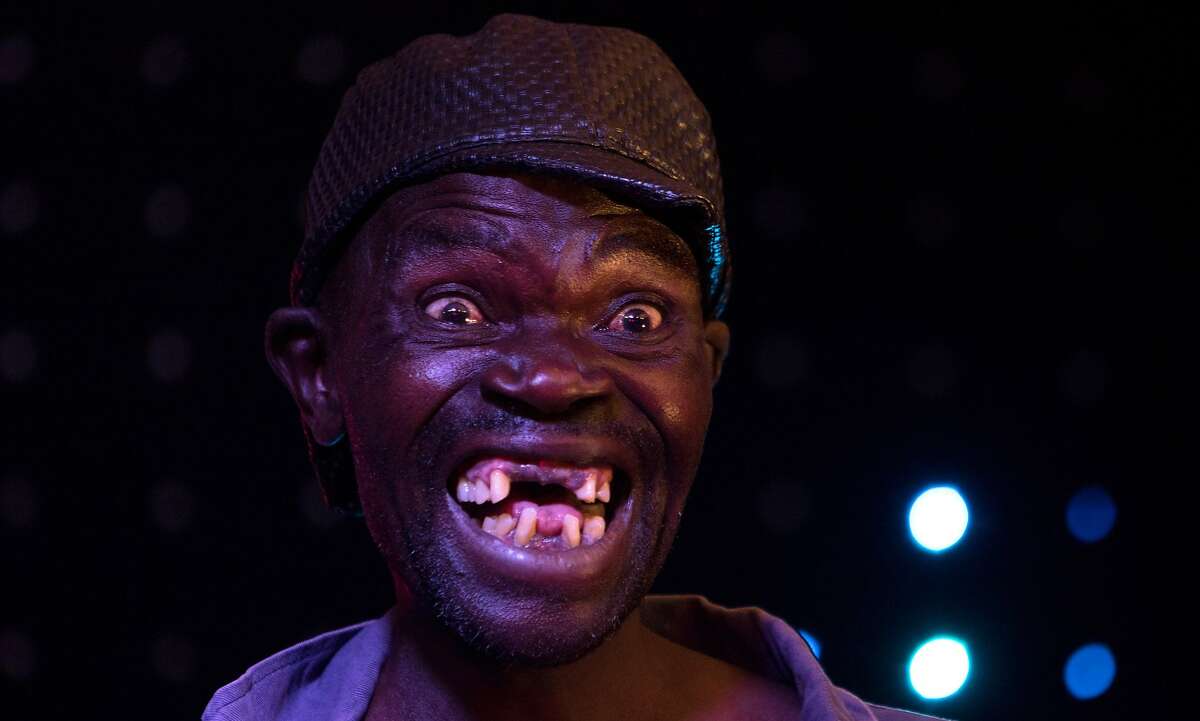 Newly crowned "Mr Ugly" Zimbabwe, Mison Sere, poses during the &q...