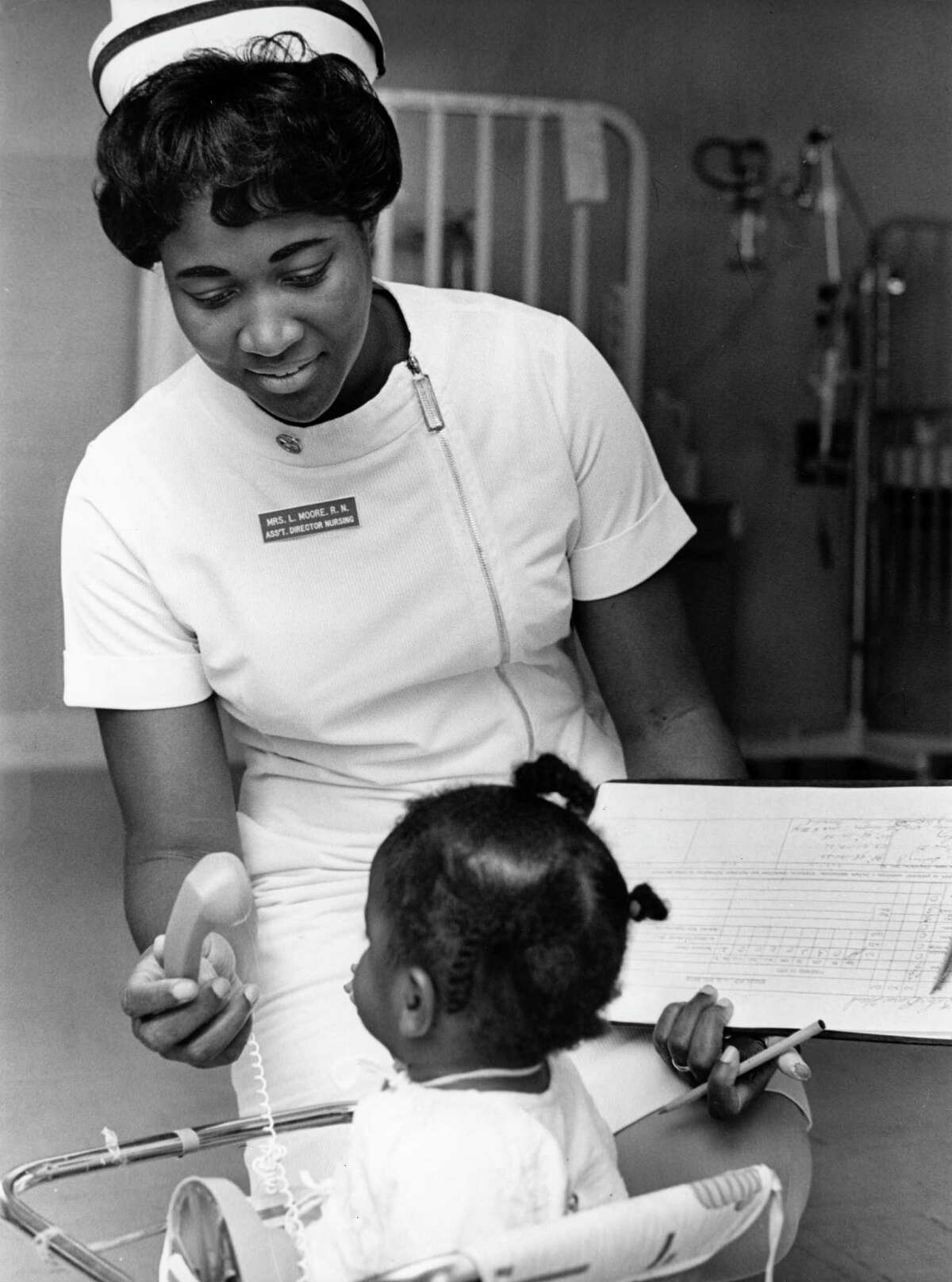 12/1968 - Lois Moore, assistant director of Nursing at Ben Taub Hospital, often stops to see younger patients.
