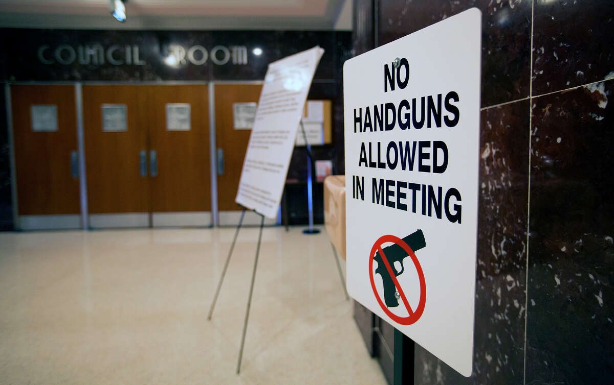 A sign warns that guns are not allowed in the City Council room in Houston City Hall.