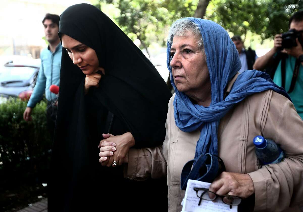 (FILES) - A file picture taken on August 10, 2015 in the capital Tehran, shows Mary Rezaian (R), the mother of detained Washington Post correspondent Jason Rezaian and his wife Yeganeh Salehi (L) leaving the Revolutionary Court after a hearing. Iran has sentenced the Washington Post reporter to prison, the country's judiciary spokesman said on November 22, 2015, without specifying the length of his jail term. AFP PHOTO / BEHROUZ MEHRIBEHROUZ MEHRI/AFP/Getty Images