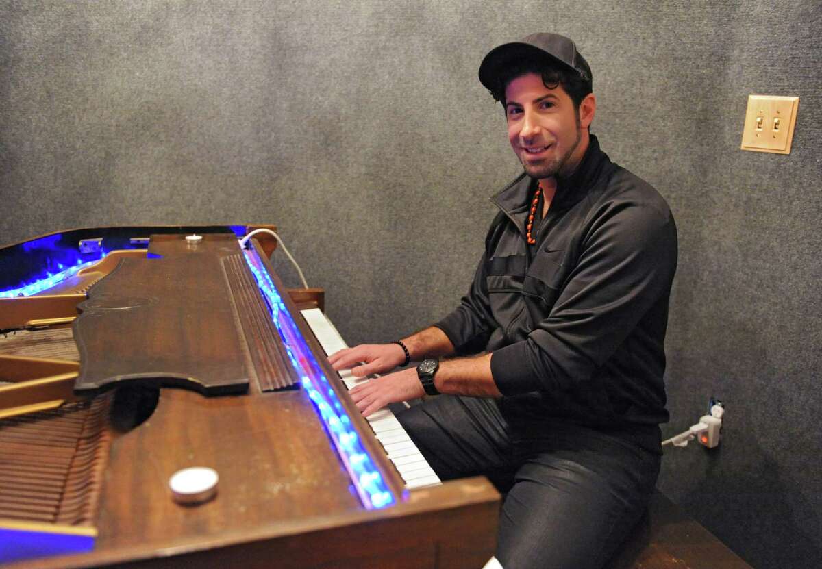 Record producer Eddie "Angelikson" Cascio plays the piano at the Recording Studio of Albany on Tuesday, Nov. 17, 2015 in Albany, N.Y. He produced some tracks for the final album by Michael Jackson and was friends with him growing up. (Lori Van Buren / Times Union)