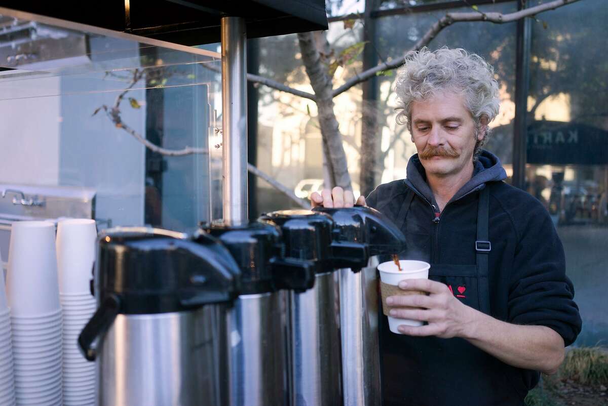 Richard Hess pours coffee for a customer in downtown San Jose, Calif. on Thursday, Nov. 12, 2015. Kartma is run by people transitioning out of homelessness.