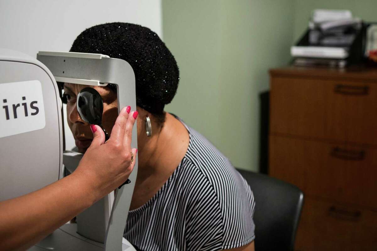 Carolyn Davis has a retinal scan done at Martin Luther King, Jr., Health Center on Thursday, Nov. 19, 2015, in Houston.