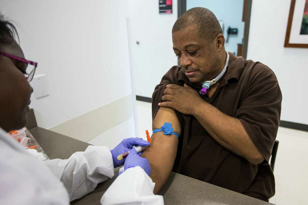 Melvin Butcher has blood drawn by Vilvia Williams at Martin Luther King, Jr., Health Center on Thursday, Nov. 19, 2015, in Houston.