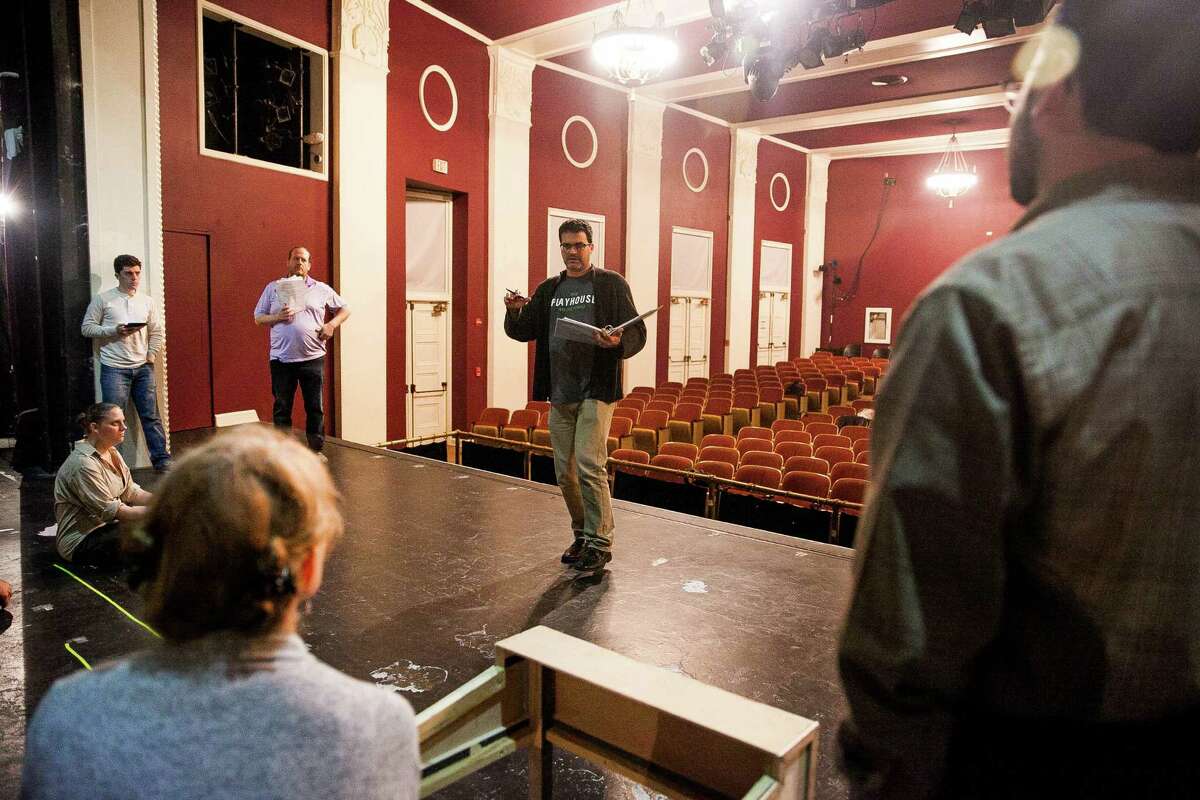 Tony Ciaravino, co-director and co-writer of The Playhouse San Antonio’s production of “A Christmas Carol,” gives notes to the cast during a rehearsal three weeks before opening night.