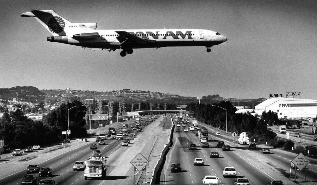 Planes land and take off at runways rarely used because of the wind at San Francisco International Airport in 1987.