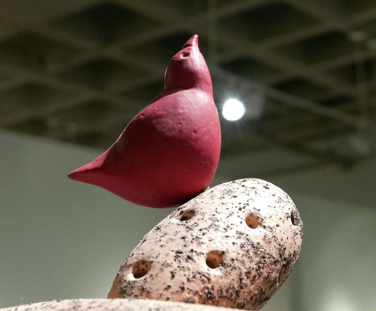 Artist Dennis Smith's piece "Landscape with Red Bird #1" is on display during the show called "Formed -- A Survey of Ceramics by Dennis Smith & Colleagues" at the Southwest School of Art. Wednesday, Nov. 19, 2015.