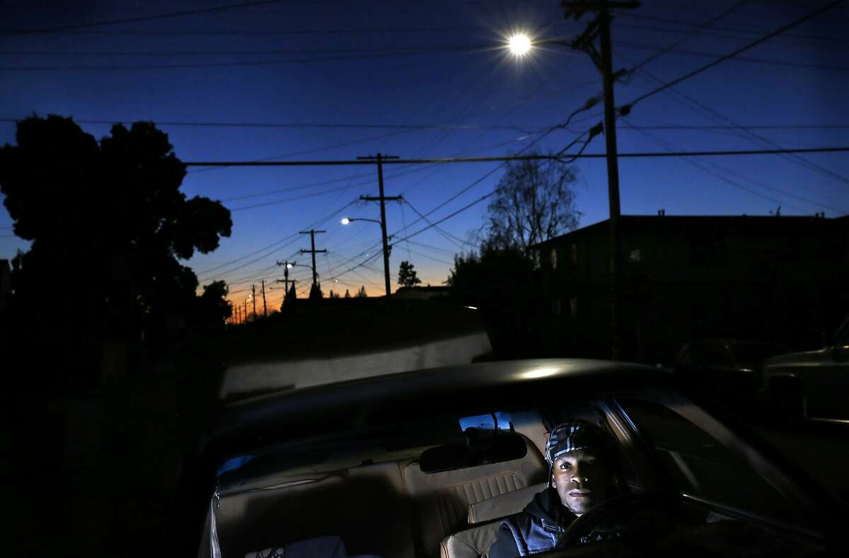 Treyvon Coulter, 22, pictured in his car outside of his East Oakland home Nov. 25, 2015 in Oakland, Calif. In the last few years since Coulter has been driving, he says he has been pulled over about 10 times.