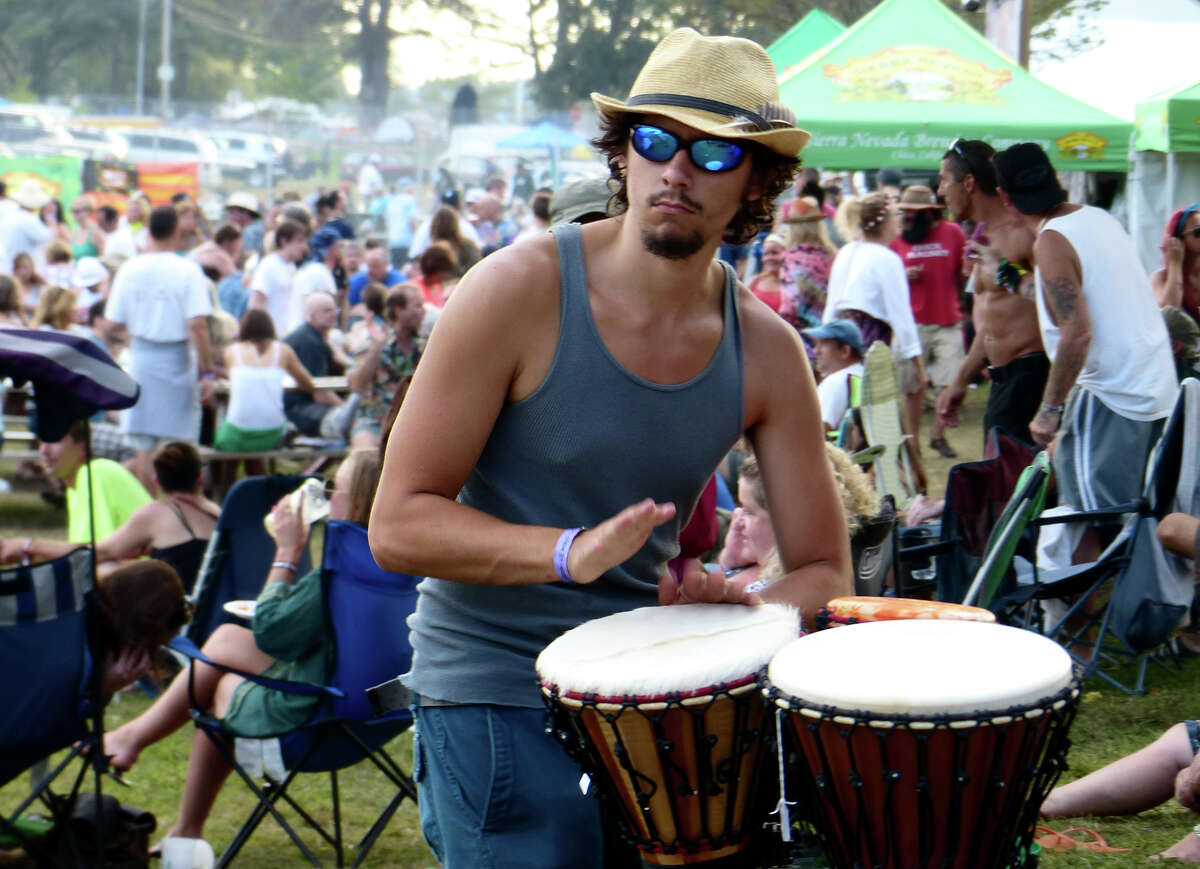 Jack Sheehan, of Trumbull, beats a conga drum set up at the 18th Annual Gathering of the Vibes music festival at Seaside Park in Bridgeport, Conn. in 2013. The music fesival will not return to Bridgeport in 2016.