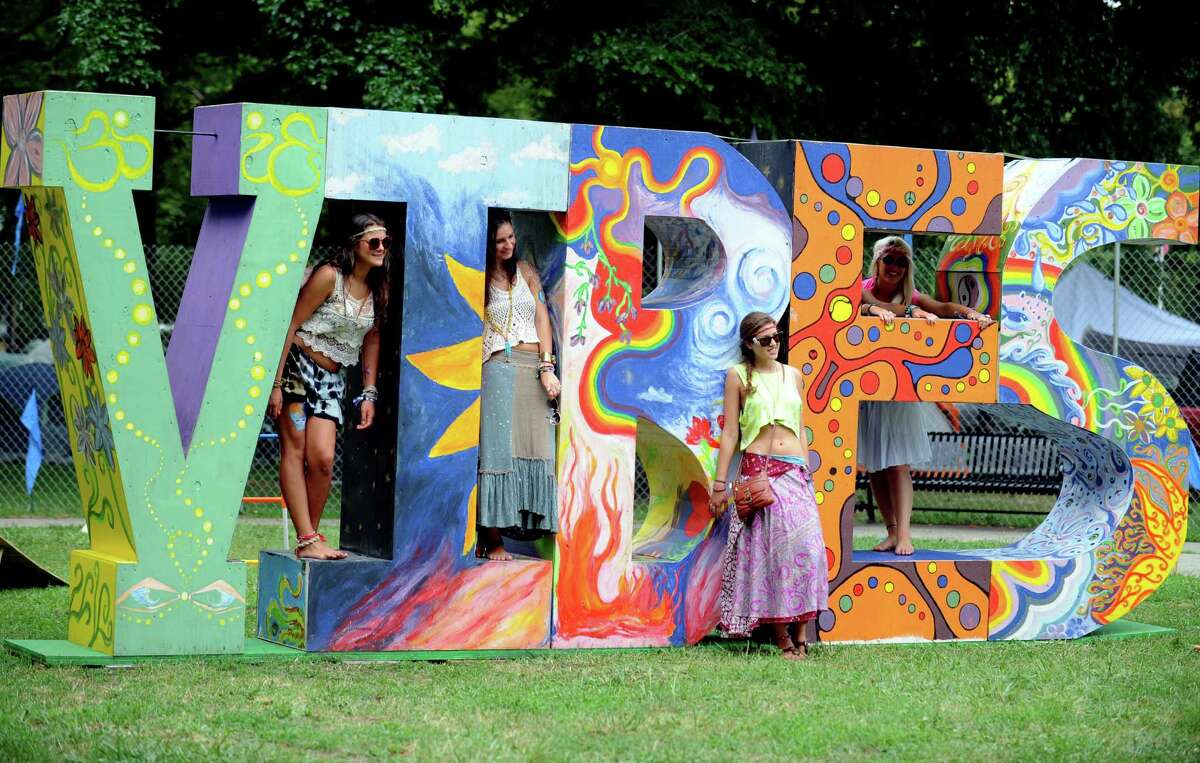 Ken Hayes, founder and promoter of The Gathering of the Vibes, posted on the event's web site that after 20 years, the event would not be coming to Bridgeport in 2016. Friends, from left, Nicole DiPaolo, of Scituate, MA, Julie Benefico, of Stamford, Nicole Fougere, of Milford, NH, and Julianna Caduto, of Wickford, RI, pose for a photo at the Gathering of the Vibes at Seaside Park in Bridgeport, Conn. Thursday, July 19, 2012.