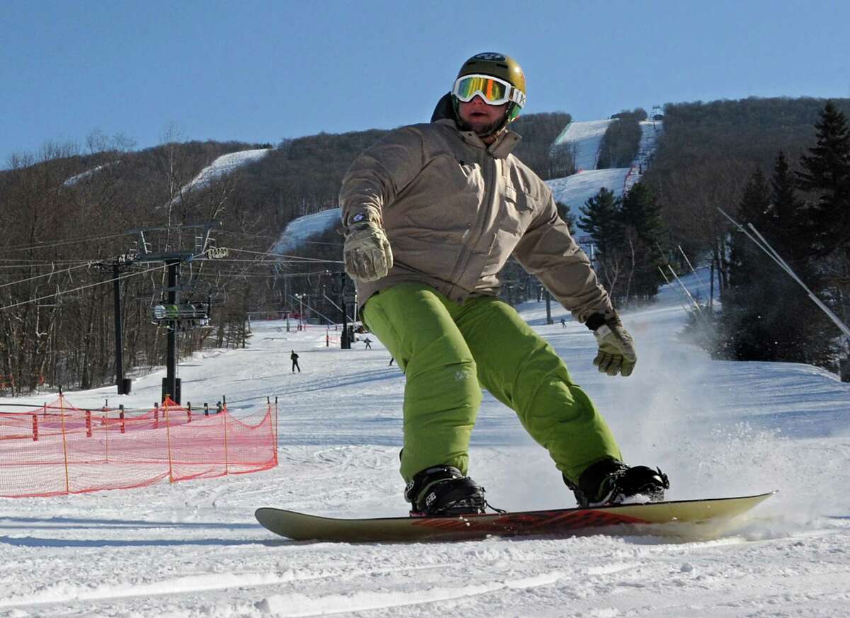 Jason Rubin of Lindenhurst, Long Island enjoys snowboarding on a nice day at Jiminy Peak ski area Friday, Feb. 7, 2014 in Hancock, Mass. (Lori Van Buren / Times Union archive)