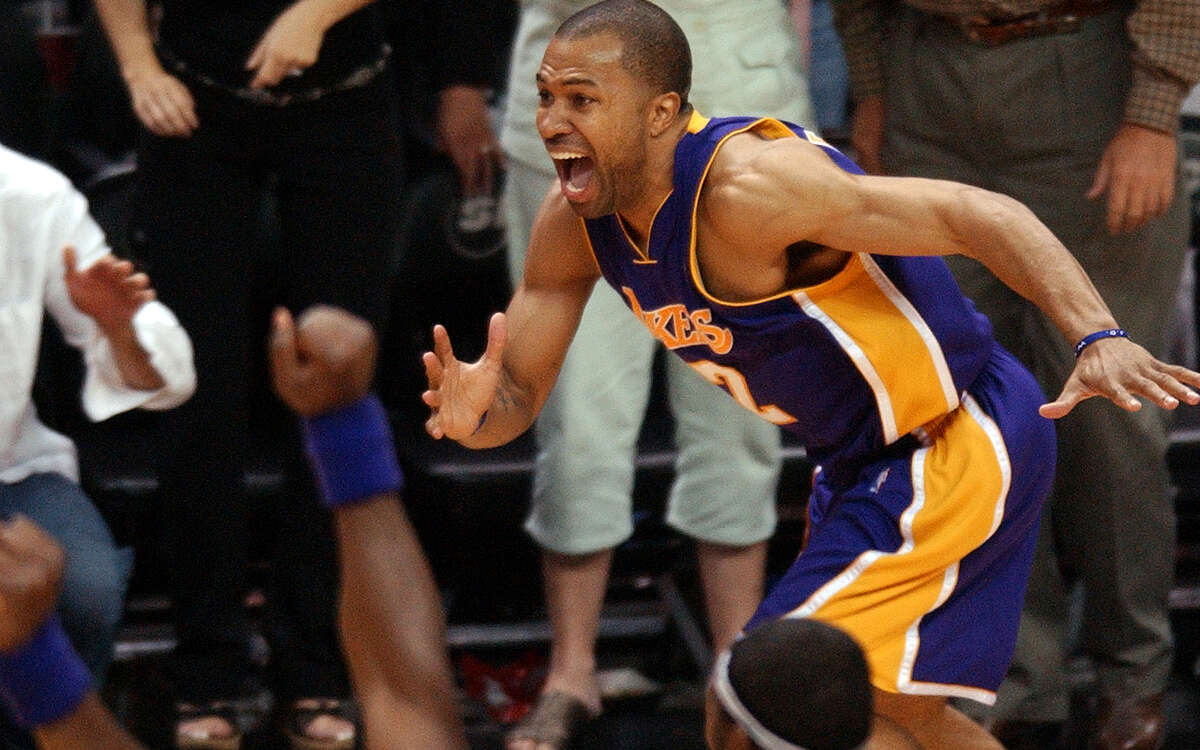 Lakers guard Derek Fisher celebrates after hitting the winning 3-pointer to defeat the Spurs 74-73 in Game 5 of the 2004 Western Conference semifinals.