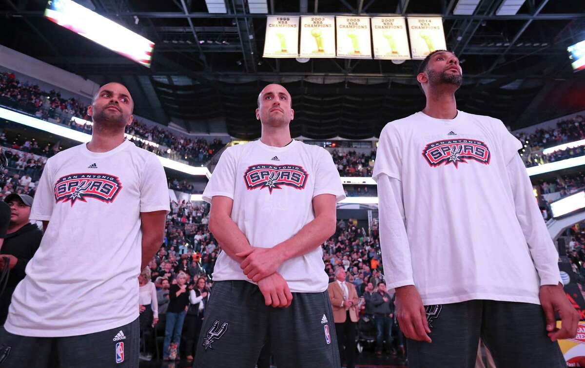 San Antonio Spurs' Tony Parker (from left), Manu Ginobili, and Tim Duncan stand during the national anthem before the game with the Charlotte Hornets Saturday Nov. 7, 2015 at the AT&T Center.