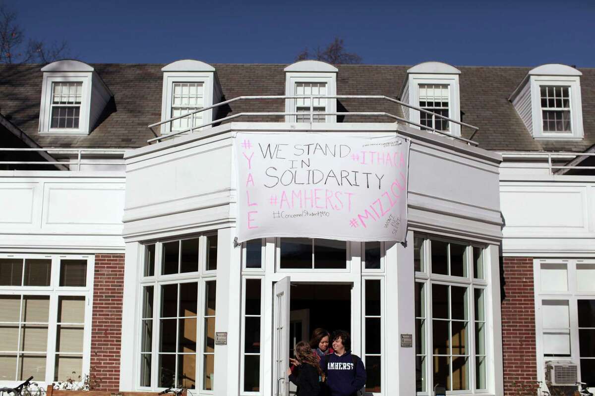 A message of solidarity hangs above the student cafeteria at Amherst College﻿. Minority students at Amherst, like ﻿activists elsewhere, ﻿have made demands borne ﻿of their perception of racism and other forms of discrimination on campus, leaving administrators trying to strike a difficult balance in responding.
