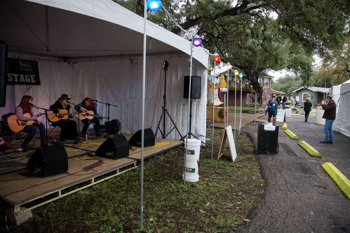 Karen Mal, Grace Pettis and Kim Miller perform during the Wimberley Alive event in Wimberley, Texas on November 28, 2015. The event is a fundraiser for victims of the Memorial Day floods along the Blanco River.