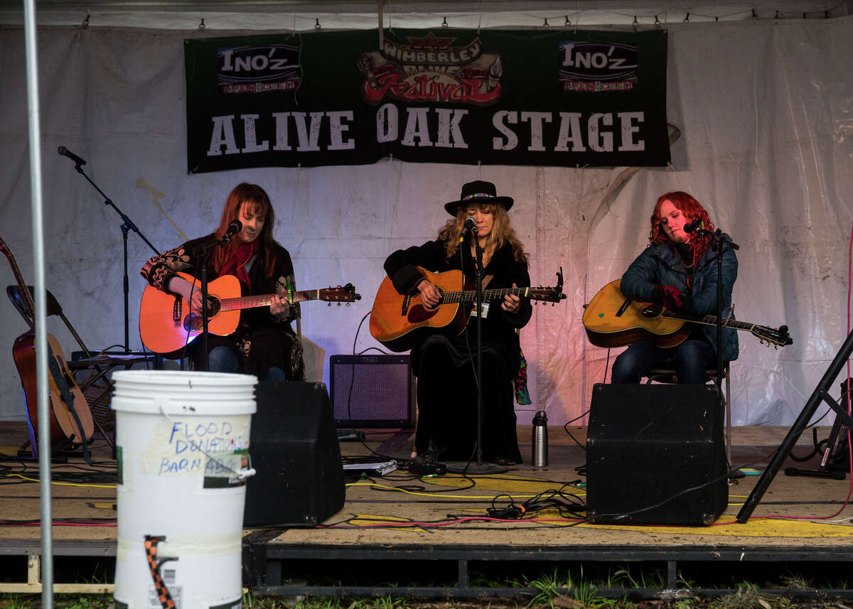 Karen Mal, Grace Pettis and Kim Miller perform during the Wimberley Alive event in Wimberley, Texas on November 28, 2015. The event is a fundraiser for victims of the Memorial Day floods along the Blanco River.