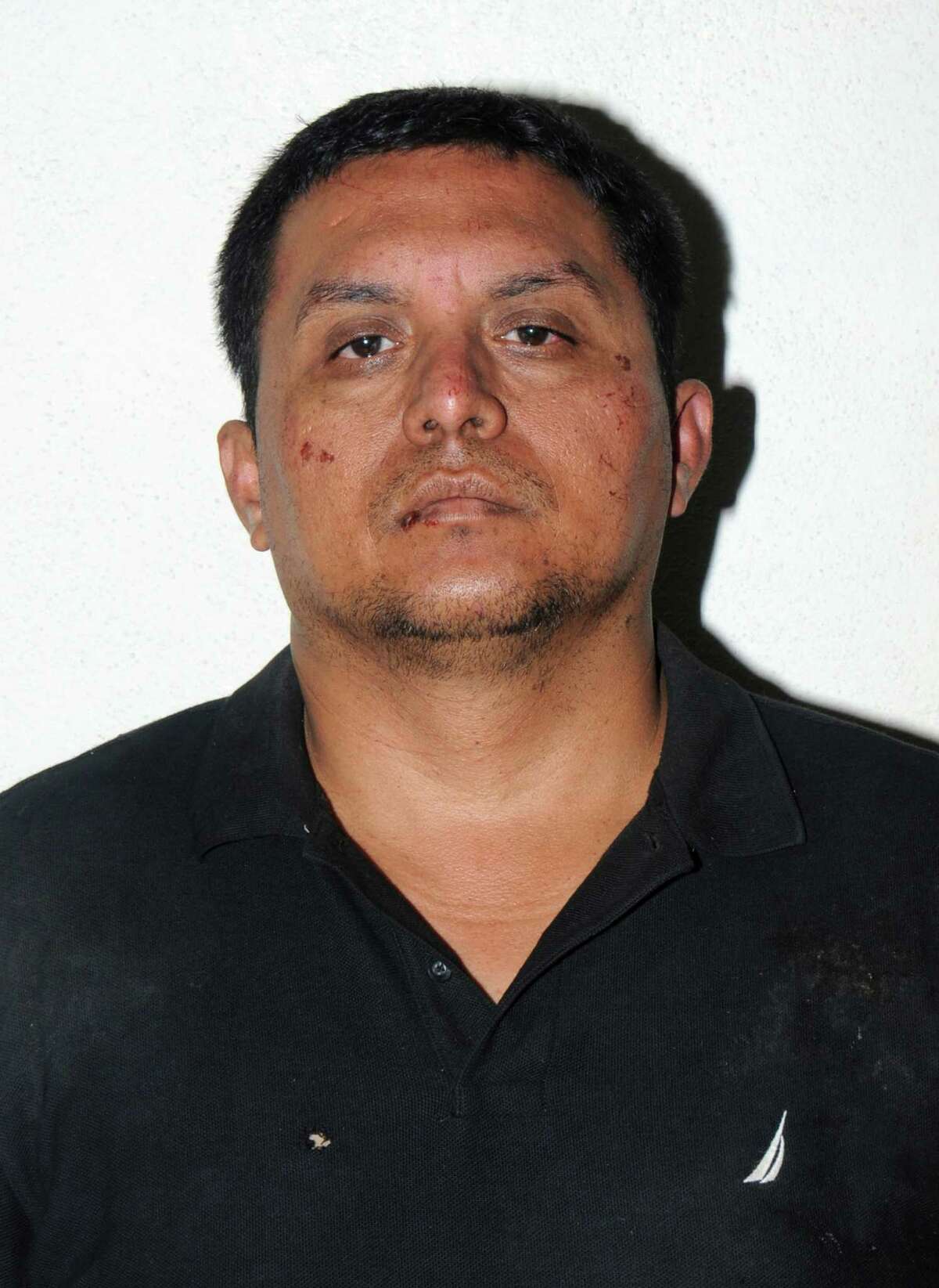 This handout photo released by the Mexican Navy SEMAR on July 16, 2013, shows Miguel Angel Treviño Morales, then head of the Zetas, after he was captured near the Texas border.