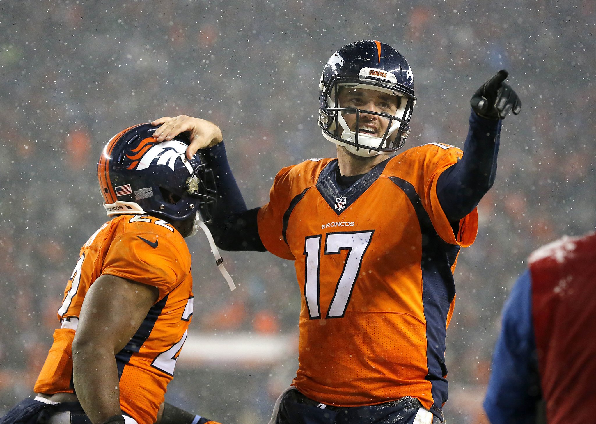 Denver Broncos quarterback Peyton Manning celebrates his 22-yard