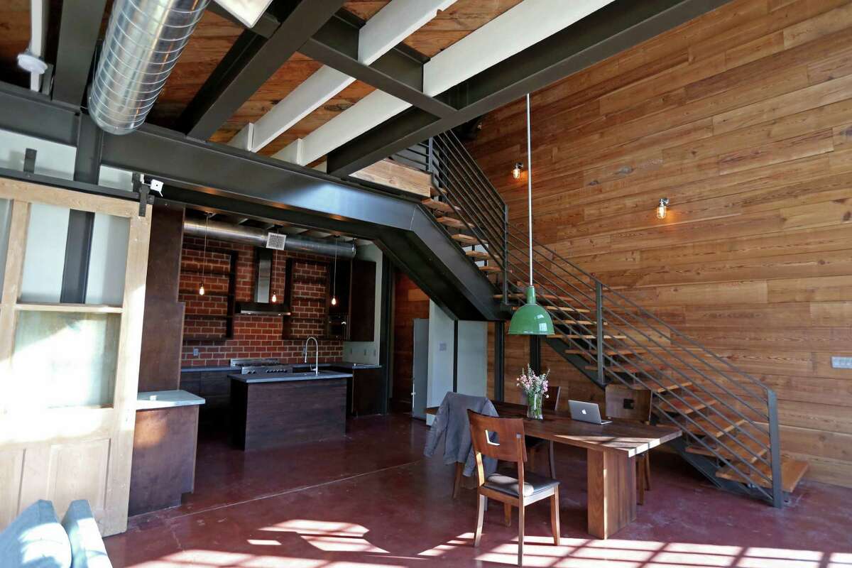 One of the lofts in the old corner store at Coronado and Enid has this open kitchen and dining area. ﻿
