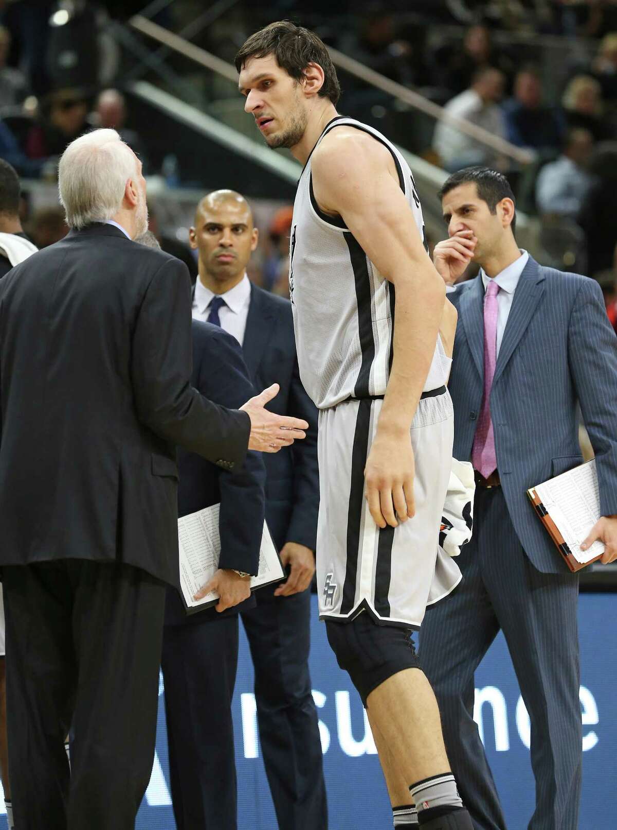 Coach Gregg Popovich confronts Boban Marjanovic during a time out as the Spurs play the Atlanta Hawks at the AT&T Center on November 28, 2015.