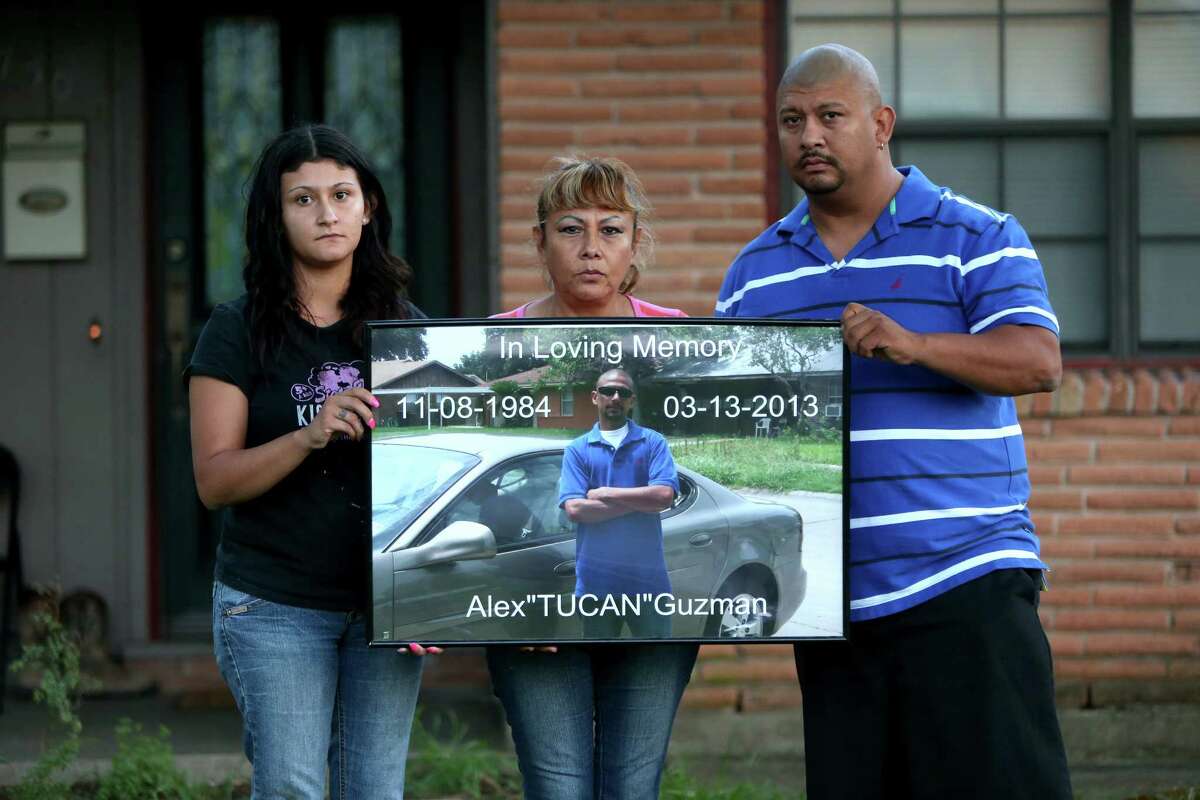 Family members display a photo of Alex Guzman, who killed himself in the Harris County Jail. From left are Yuliana Romero, Blanca Enriquez and Carlos Guzman.