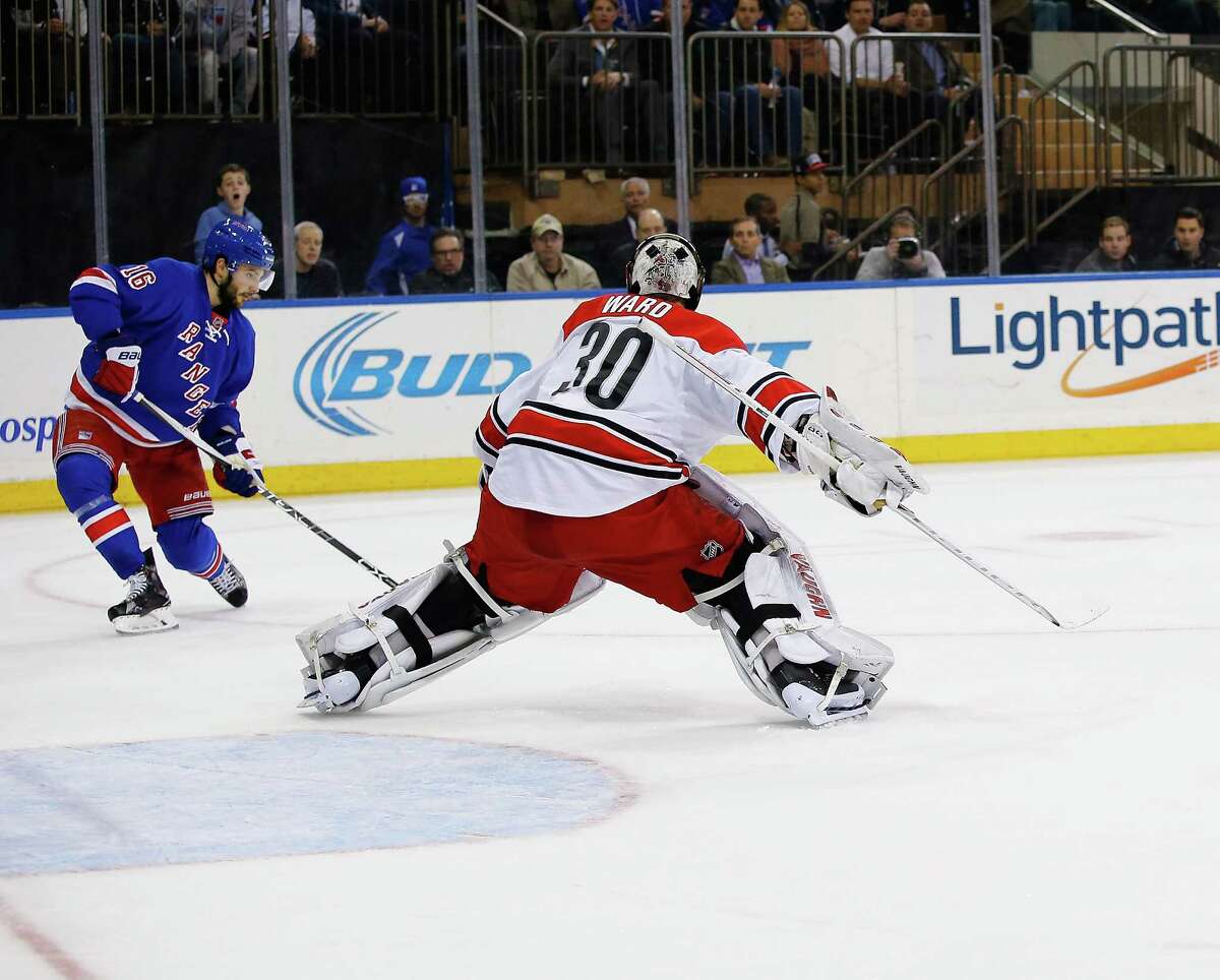 NEW YORK, NY - NOVEMBER 30: Derick Brassard #16 of the New York Rangers scores against Cam Ward #30 of the Carolina Hurricanes during their game at Madison Square Garden on November 30, 2015 in New York City. (Photo by Al Bello/Getty Images) ORG XMIT: 574712909