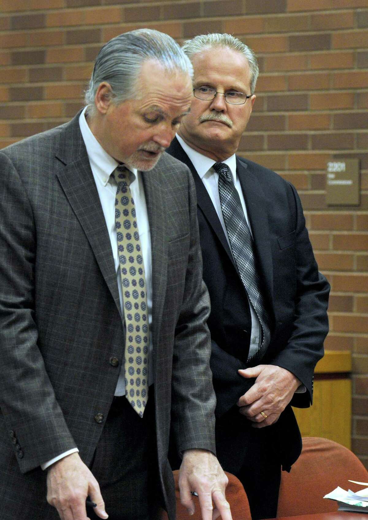Brookfield’s former school finance director Art Colley, right, appears in Superior Court in Danbury, Conn., Wednesday morning, March 25, 2015, alongside his attorney, Eugene Riccio.