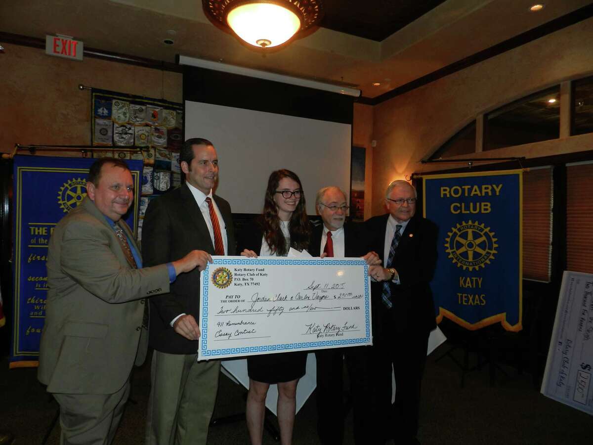 The Katy Rotary Club recognized Jordan Clark for her essay at a recent meeting. From left are: Tom Gunnell, Katy ISD deputy superintendent; Jimmy Sanders, Clark's sponsor; Clark; David Frishman and Ken Burton, Katy Rotarians who worked on the Freedom Park Memorial Tower project.