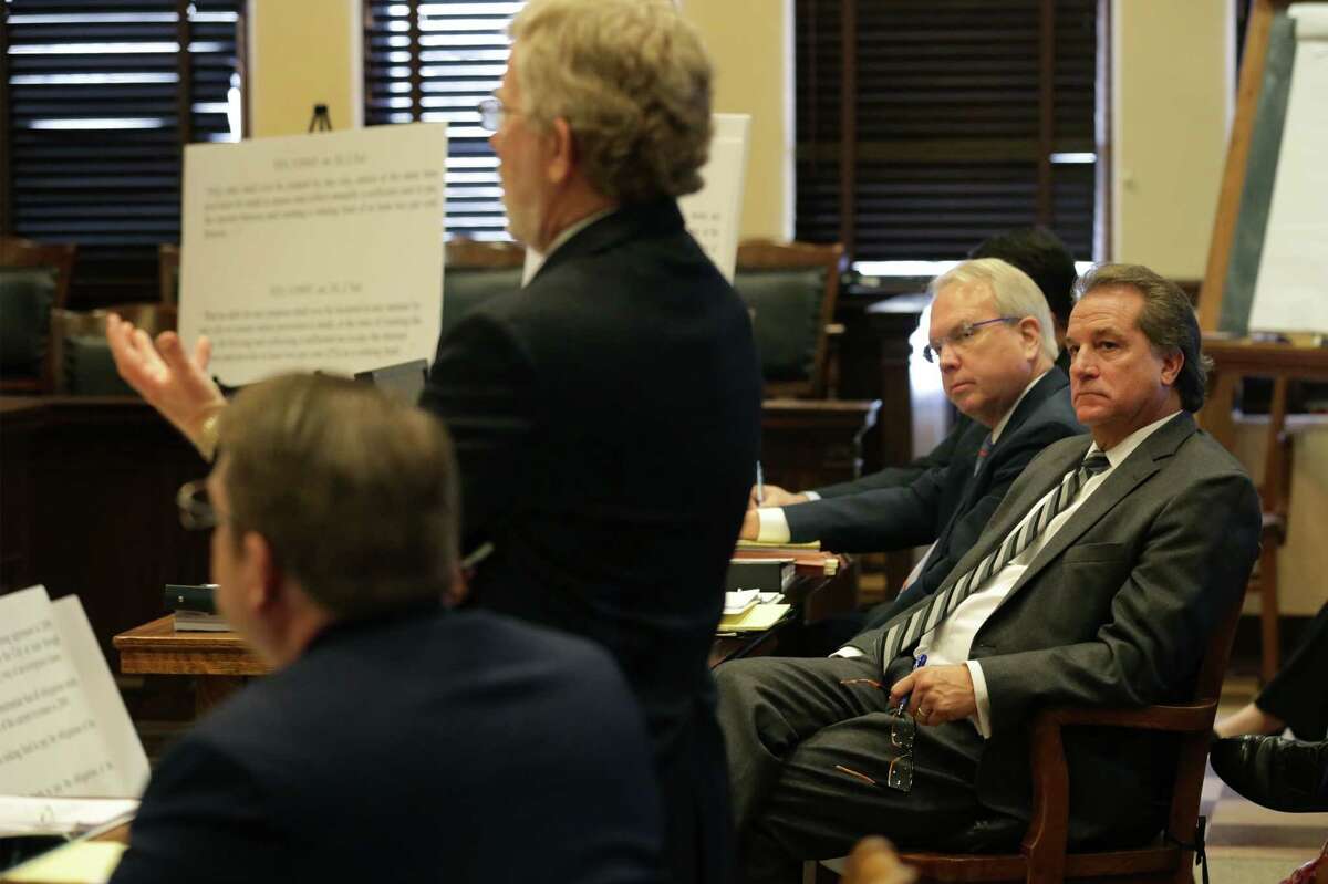 Michael Bernard, right, lawyer for the The City of San Antonio listens to Craig Deats, lawyer for the San Antonio Police Officers Association as they met in court again on Thursday, Dec. 1, 2015, before Judge Martha Tanner, to present their cases concerning a contract.