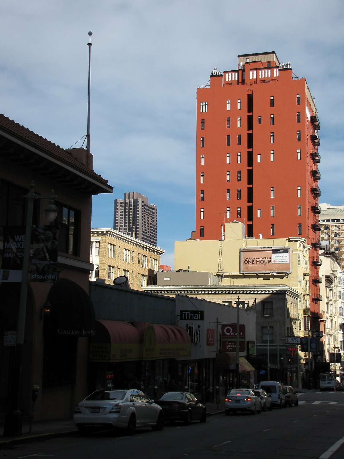 The 17-story residential tower at 666 Pine St. on the slope of Nob Hill is taller than anything on the block -- but the 1926 shaft stands out even more because of a rich coat of brick-red paint.