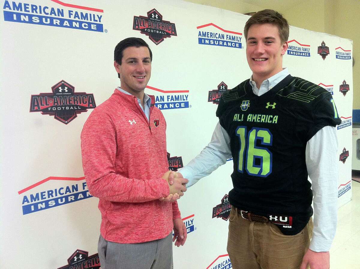 Greenwich High School senior Scooter Harrington, right, and Cardinals coach John Marinelli, shake hands following Wednesdayís press conference, which announced Harringtonís selection to the 2016 Under Armour All-America High School Football Game. The press conference was held at Greenwich High School.