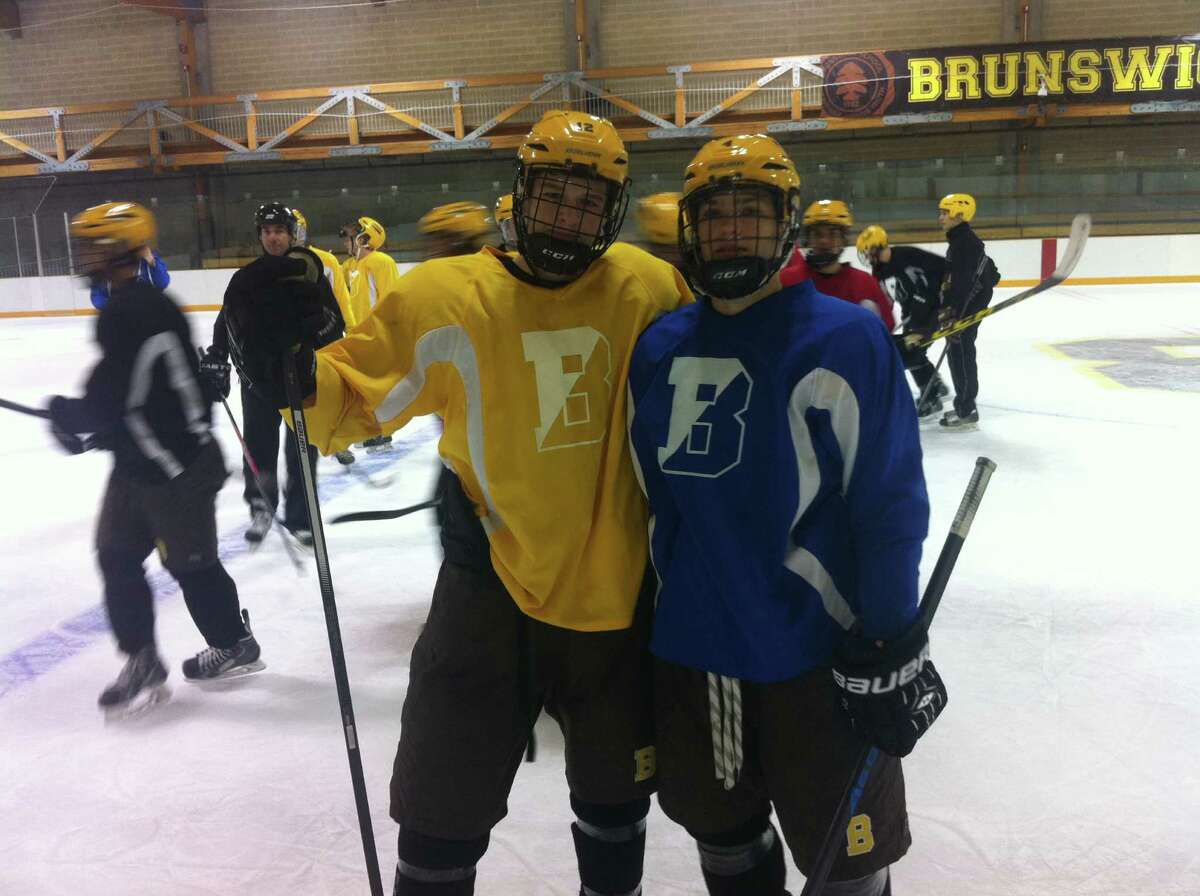 Nick VanBelle, left, and Jack Stephenson are the captains of the Brunswick School hockey team.