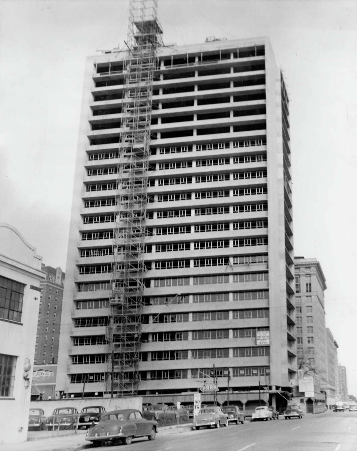 12/1951 - This unconventional skycraper, which at a distance will be silvery in tone, is the nearly completed Melrose Building, being built by Melvin A. Silverman, developer, and his New York associate, Bennett Rose. Tellepsen Construction Company is the contractor. The cost is more than $4,000,000 and completion is scheduled for February.