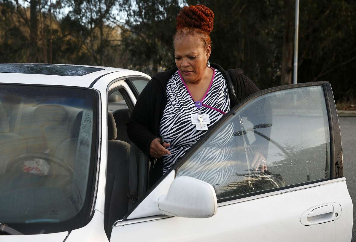 Valoria Russell-Benson gets into her car after finishing her overnight shift at Laguna Honda Hospital in San Francisco. Russell-Benson commutes to her job in the city from her home in Vacaville, a trip which can take up to two or three hours each way.