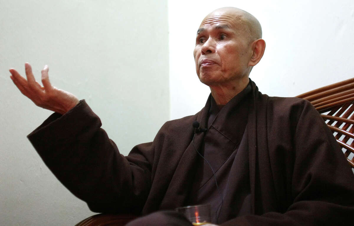 ** ADVANCE FOR THURSDAY, MARCH 29 ** FILE ** Vietnamese monk Thich Nhat Hanh talks during an interview in Hanoi, Vietnam, in this Tuesday, March 29, 2005 file photo. For the second time in two years, Thich Nhat Hanh, a Buddhist monk who was forced to live in exile for nearly four decades, has returned to his home land. Hanh has been drawing large crowds with his calls for national reconciliation. And he has been given more freedom to move and speak than the government would have allowed in the past. (AP Photo/Richard Vogel, File)