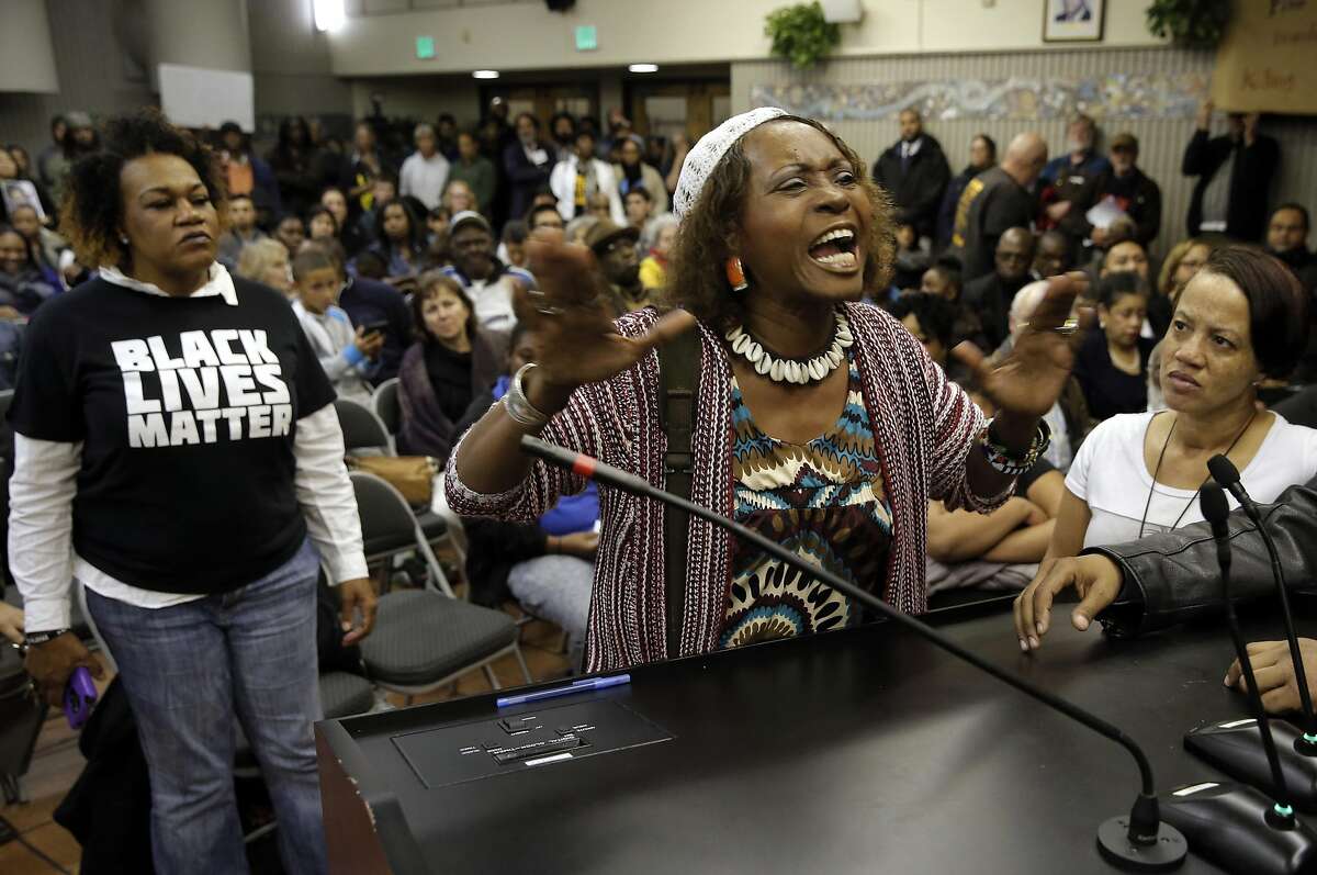 Neighborhood resident Salahaquekyah Chandler speaks her mind as the San Francisco Police department hosts a town hall meeting, on Fri. December 4, 2015 to discuss the officer-involved shooting of 26-year-old Mario Woods in the Bayview neighborhood that sparked outrage nationwide after a video taken of the shooting was circulated on social media, in San Francisco, Calif.