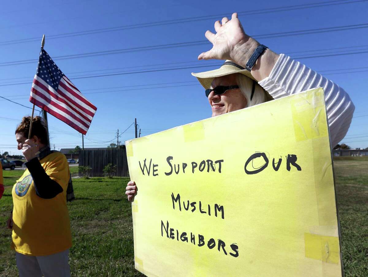 Jane Malin shows support for Muslims in the community at a Dec.?…4 rally near the Clear Lake Islamic Center in Webster.