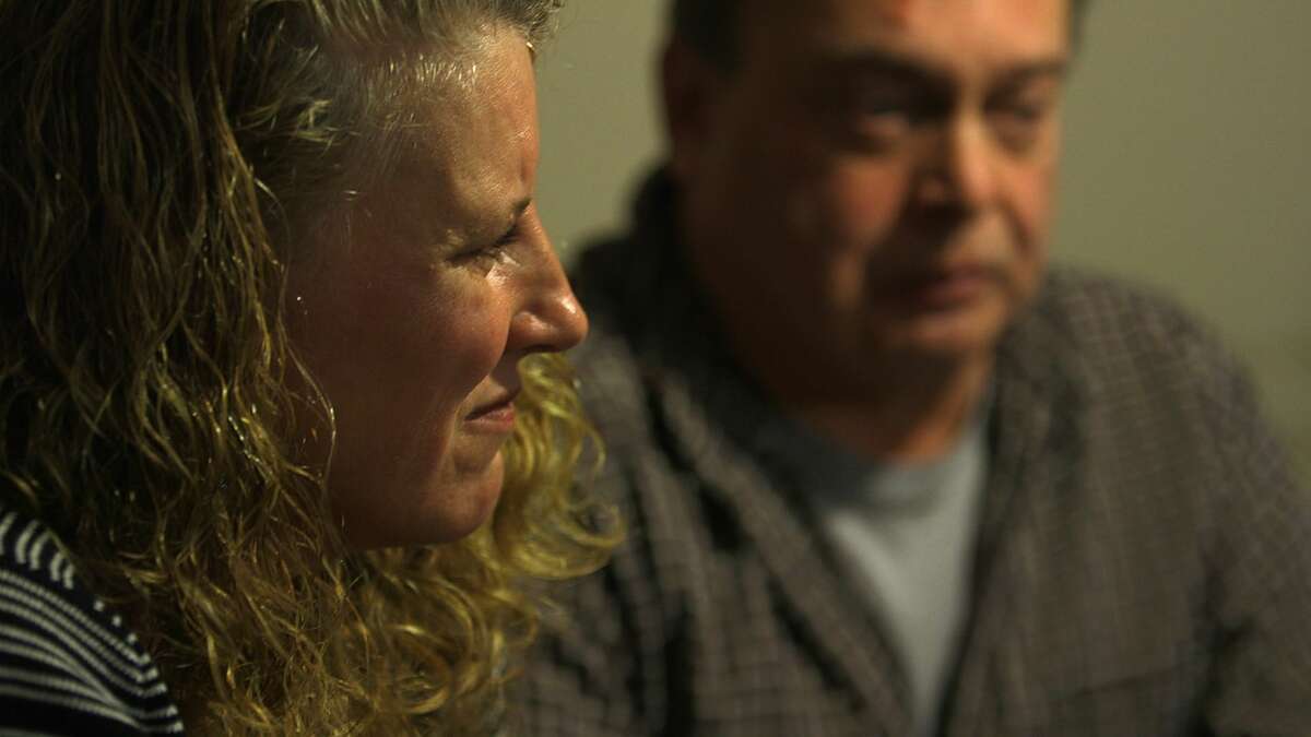 Kim and Tim Murdick talk in their West Sand Lake home's kitchen about their son, Sean, a co-captain of the Averill Park High School football team and 2011 graduate, who died on Sept. 28 at age 22 of a fatal heroin overdose in a treatment program in Florida after being turned away from programs in the Capital Region because of insurance policy limits and other issues. (Photo by Nicole Van Slyke and Brian Flynn / WMHT)