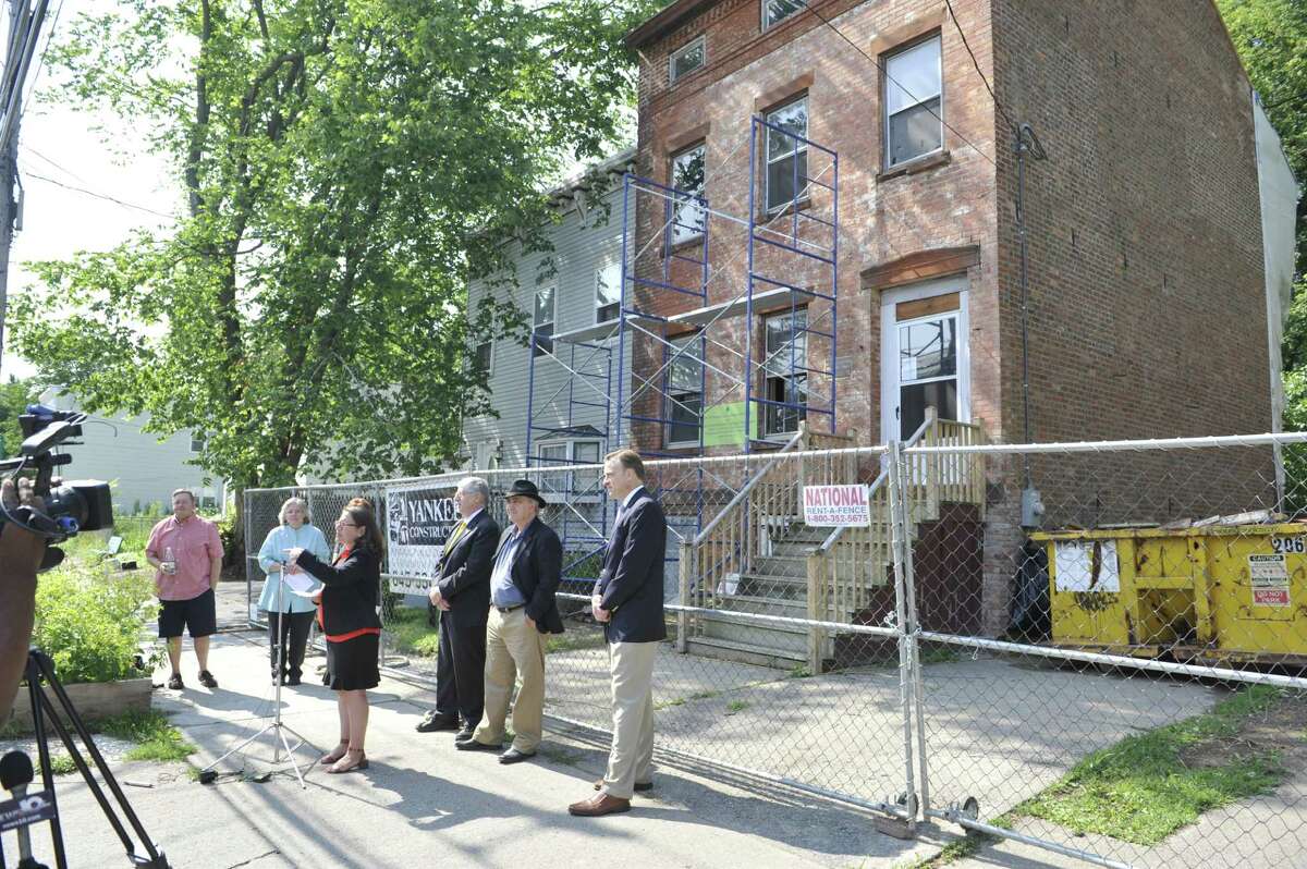 Susan Holland, executive director of The Historic Albany Foundation, addresses those gathered for a press conference out in front of the Stephen and Harriet Myers home at 194 Livingston Avenue on Tuesday, July 29, 2014, in Albany, N.Y. The press event was held for members of the foundation to talk about a project where they have compiled a list of oldest buildings in the city. (Paul Buckowski / Times Union)