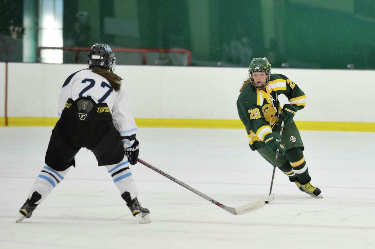 Greenwich Academy's Meghan Keating carries the puck up ice towards the Canterbury net.