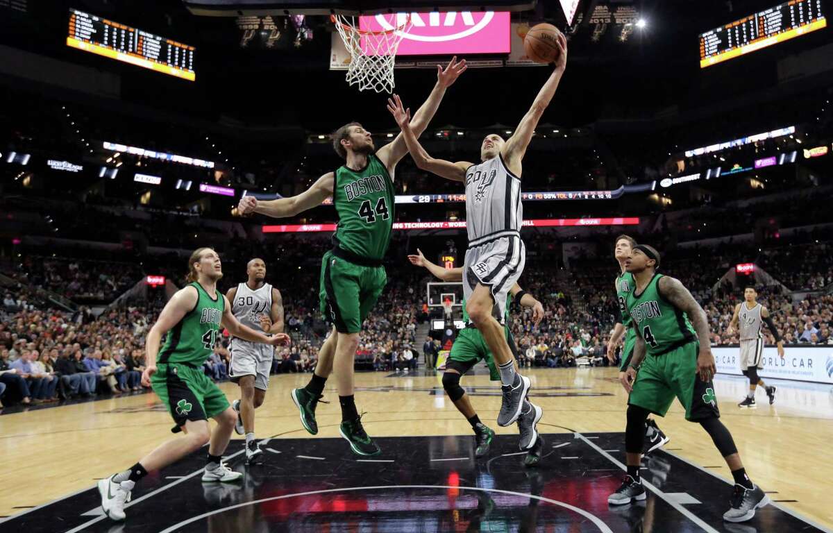 5086 x 3254~~$~~San Antonio Spurs guard Manu Ginobili (20) drives to the basket against Boston Celtics center Tyler Zeller (44) during the first half of an NBA basketball game, Saturday, Dec. 5, 2015, in San Antonio.