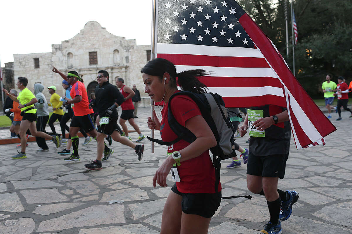 Runners make their way through Alamo Plaza during the the recent Rock ’n’ Roll San Antonio Marathon. A reader says the best way to respect the past is to leave the plaza as it is.