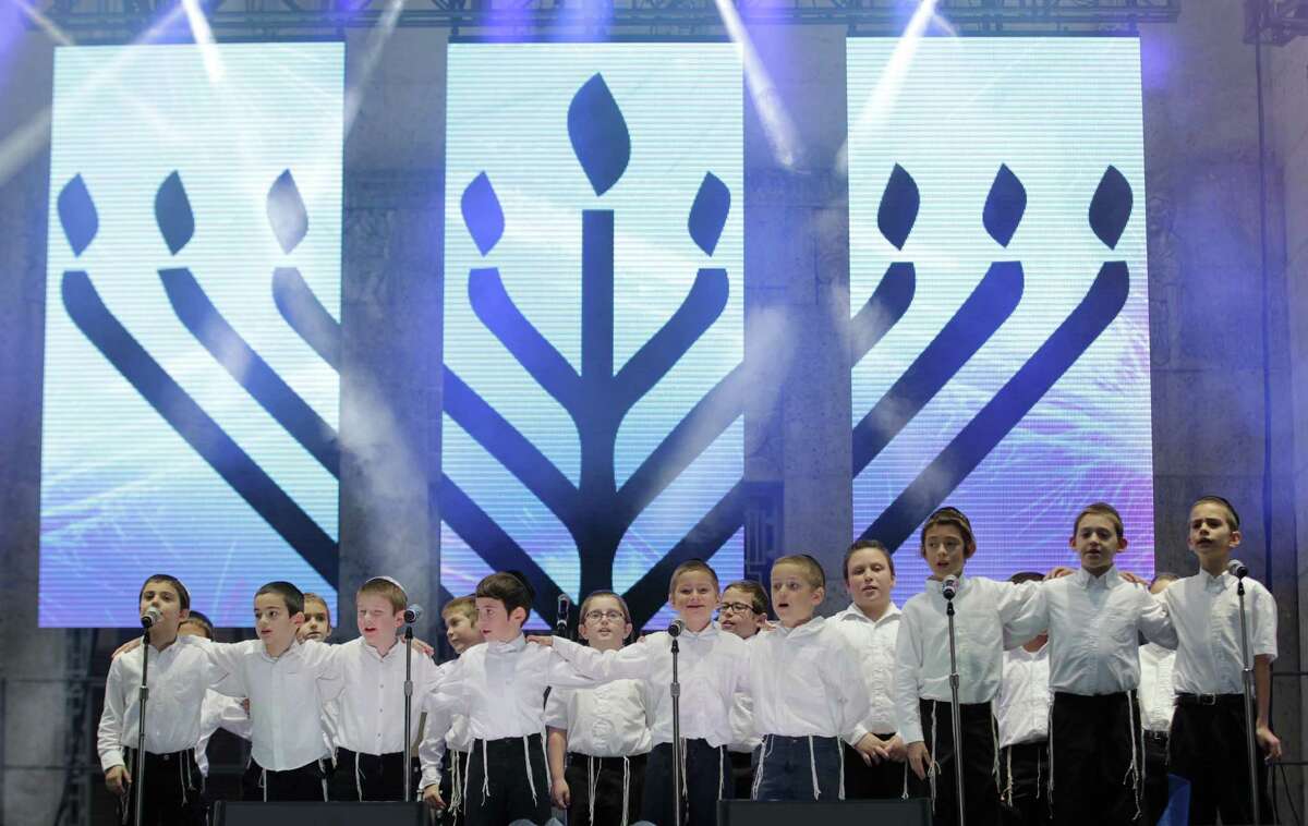 The Torah Day School Boy's Choir performs during Chanukah Fest 2015 at Hermann Square Park Sunday, Dec. 6, 2015, in Houston.