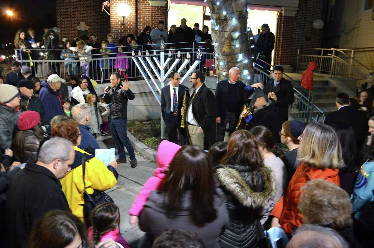 A crowd turned out Sunday evening for the menorah-lighting ceremony to mark the start of Hanukkah sponsored by the town's four Jewish congregations.
